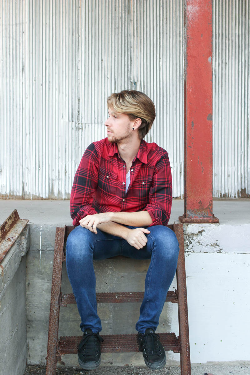 The Kentucky Gent in a Buffalo Plaid Shirt by JACHS, White V-Neck T-Shirt by BDG, Jeans by Topman, Black chucks by Converse.