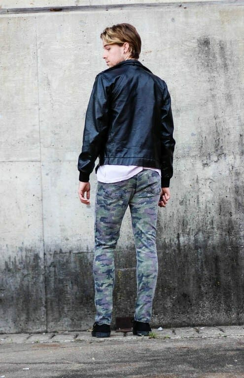 The Kentucky Gent in Rad T-Shirt by UNIF, Black Apple Leather Jacket, Tripp NYC Camo Rocker Pants, and Black Chucks by Converse