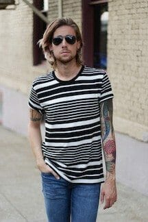 The Kentucky Gent, a men's fashion and life style blogger, in BDG Striped T-Shirt, Levi's 511 Jeans, Dr. Martens Combat Boots, and Ray-Ban Aviator Sunglasses.