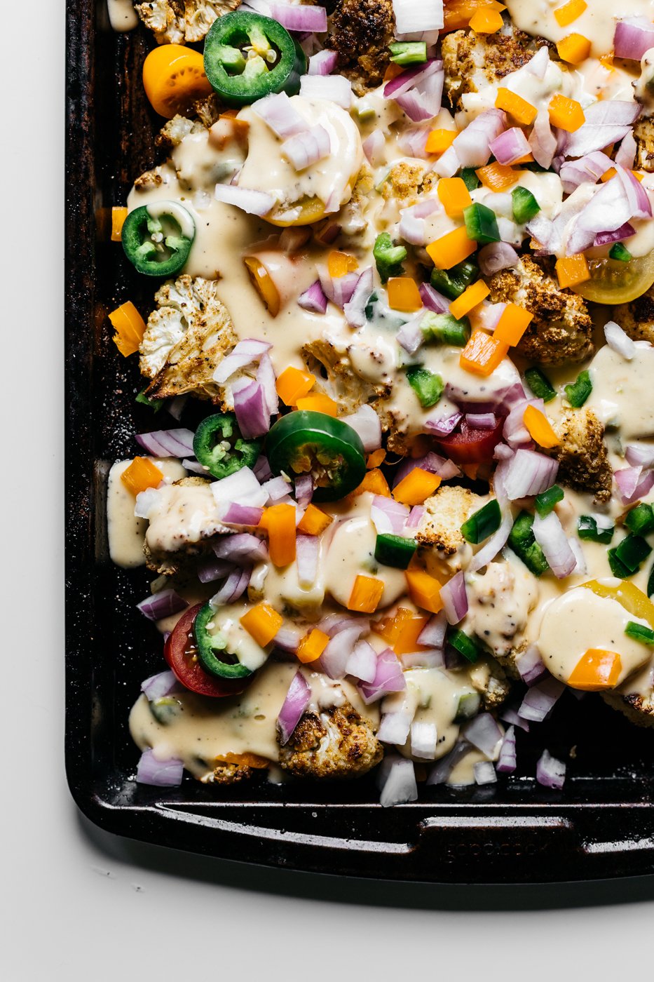 loaded cauliflower nachos, cauliflower nachos, low carb nachos, vegetarian appetizers, pride party food, rainbow food