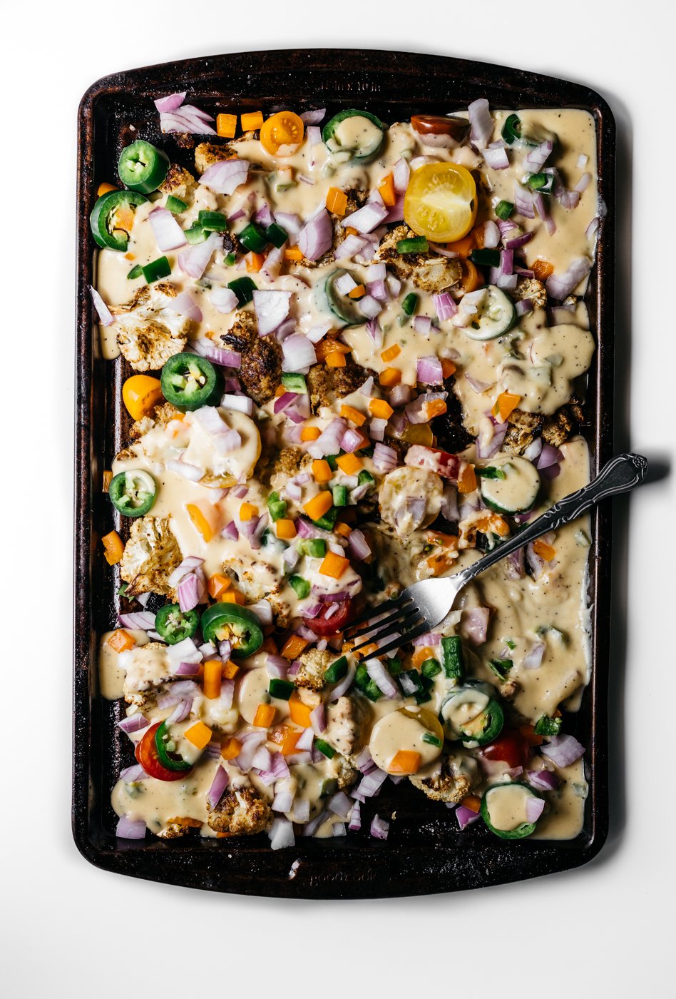 loaded cauliflower nachos, cauliflower nachos, low carb nachos, vegetarian appetizers, pride party food, rainbow food