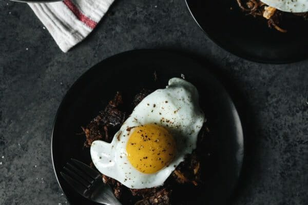chili hash browns topped with egg