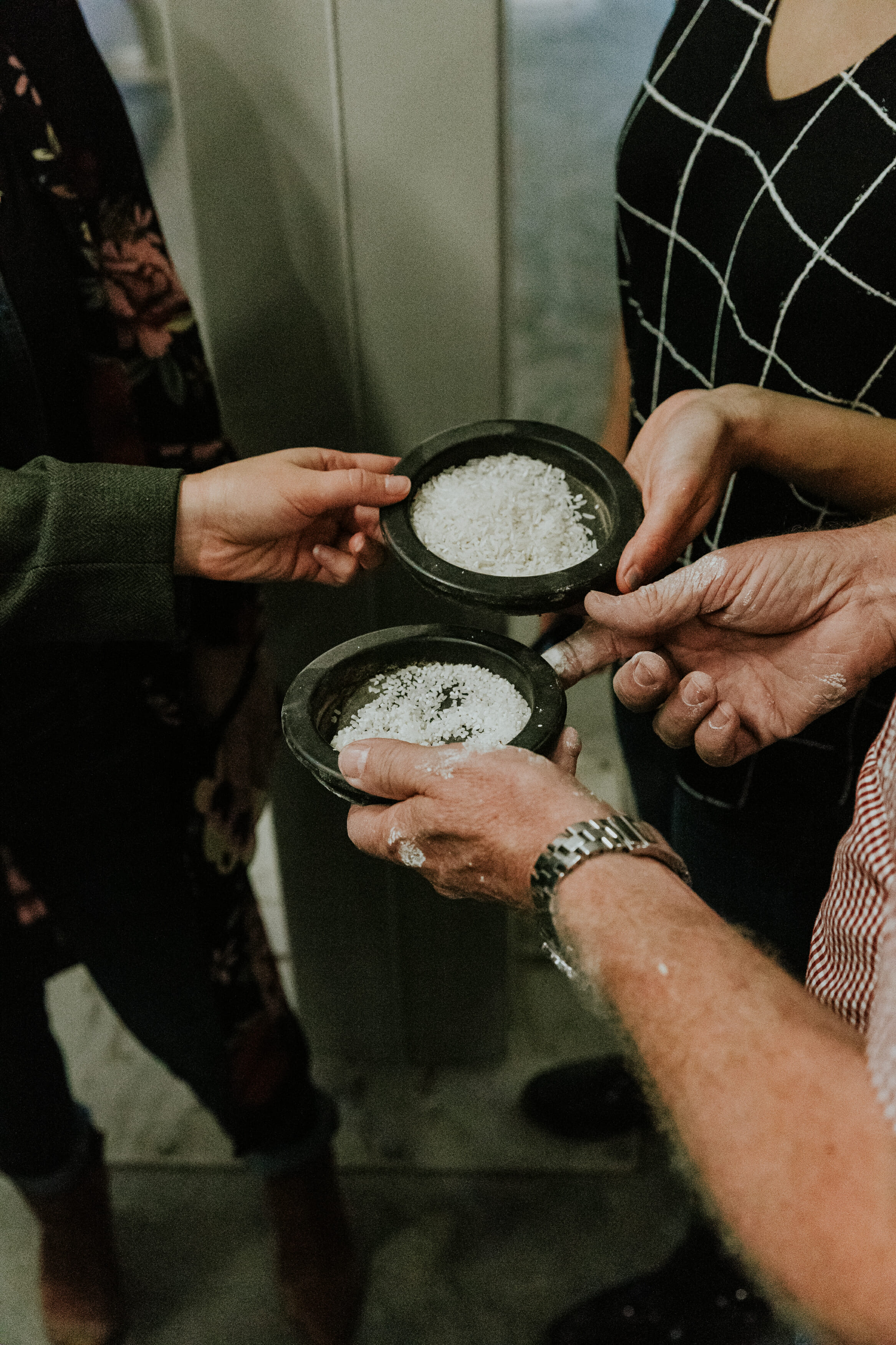 hands holding rice