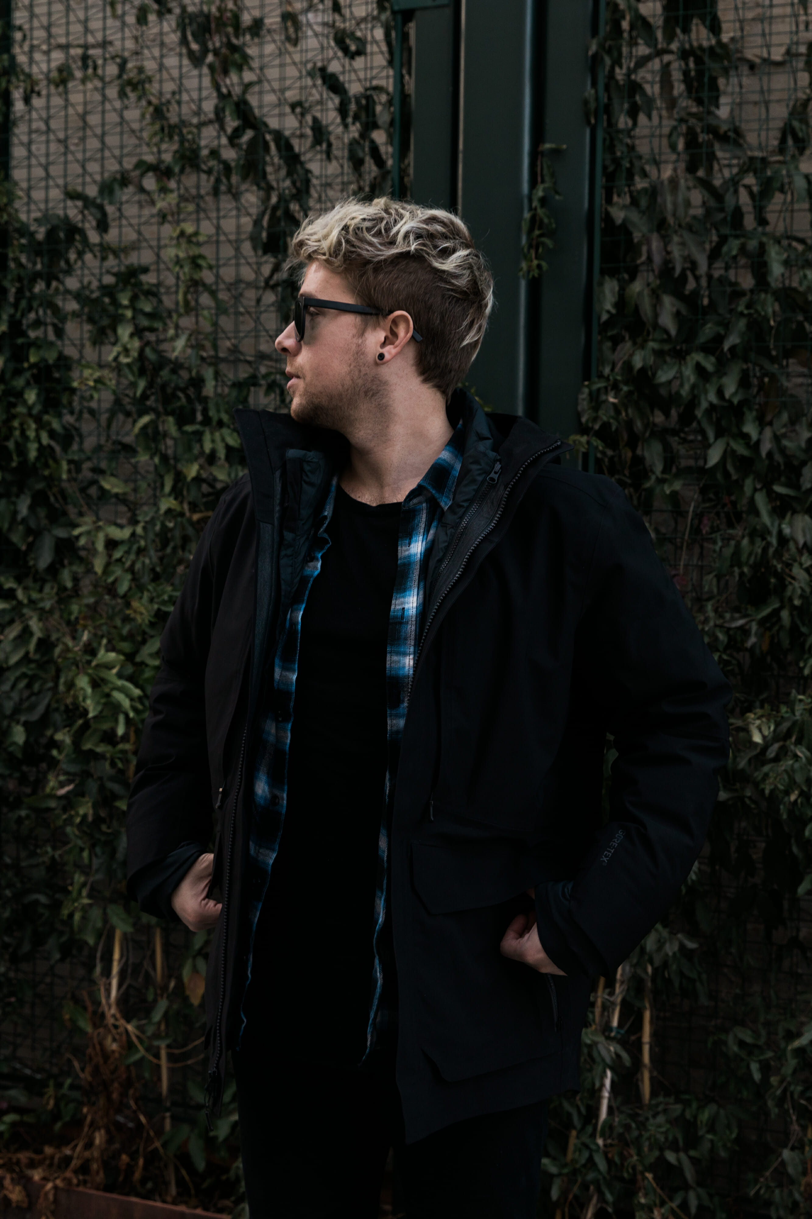 blue plaid shirt and black north face jacket