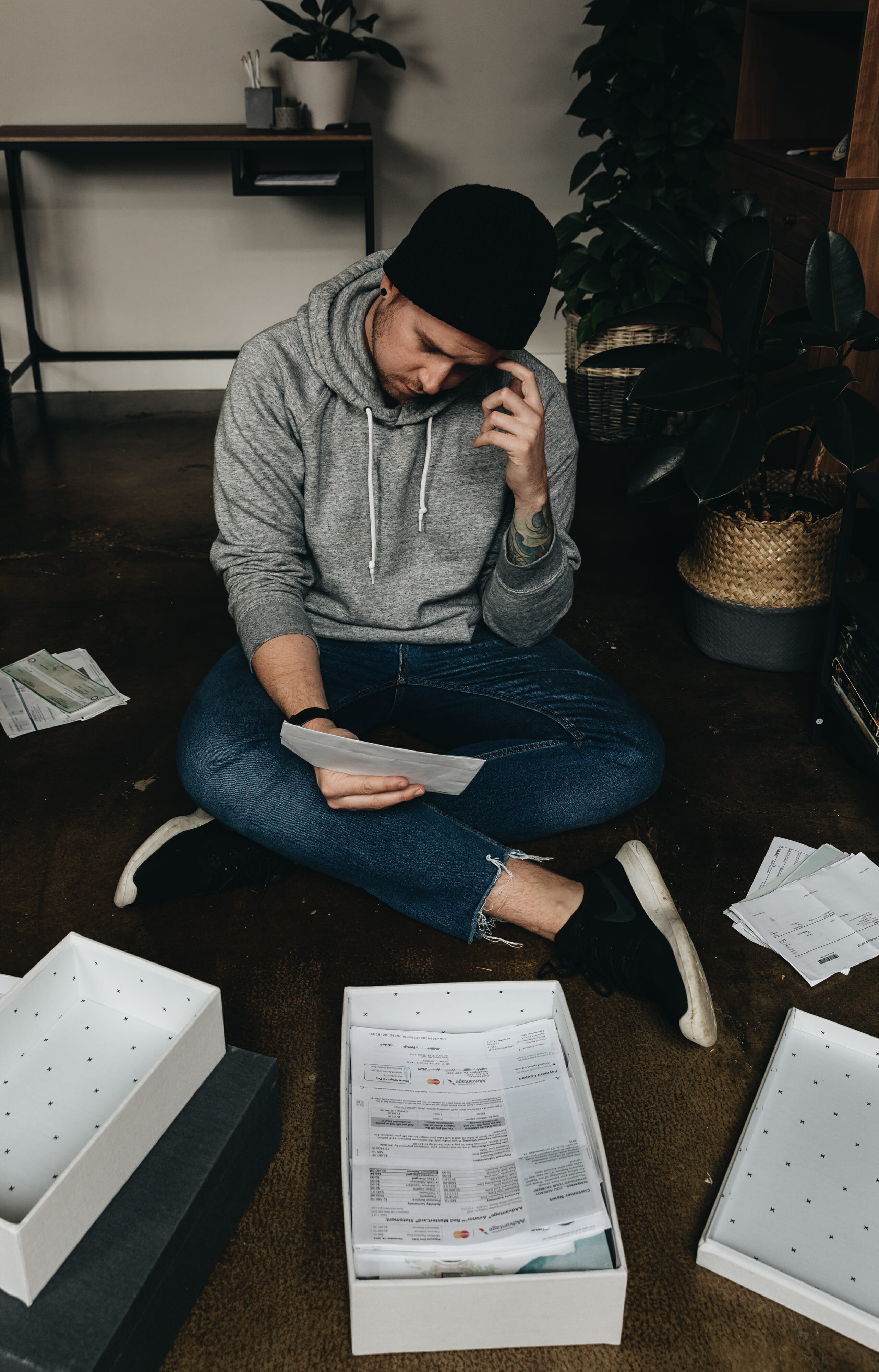 man sorting through receipts