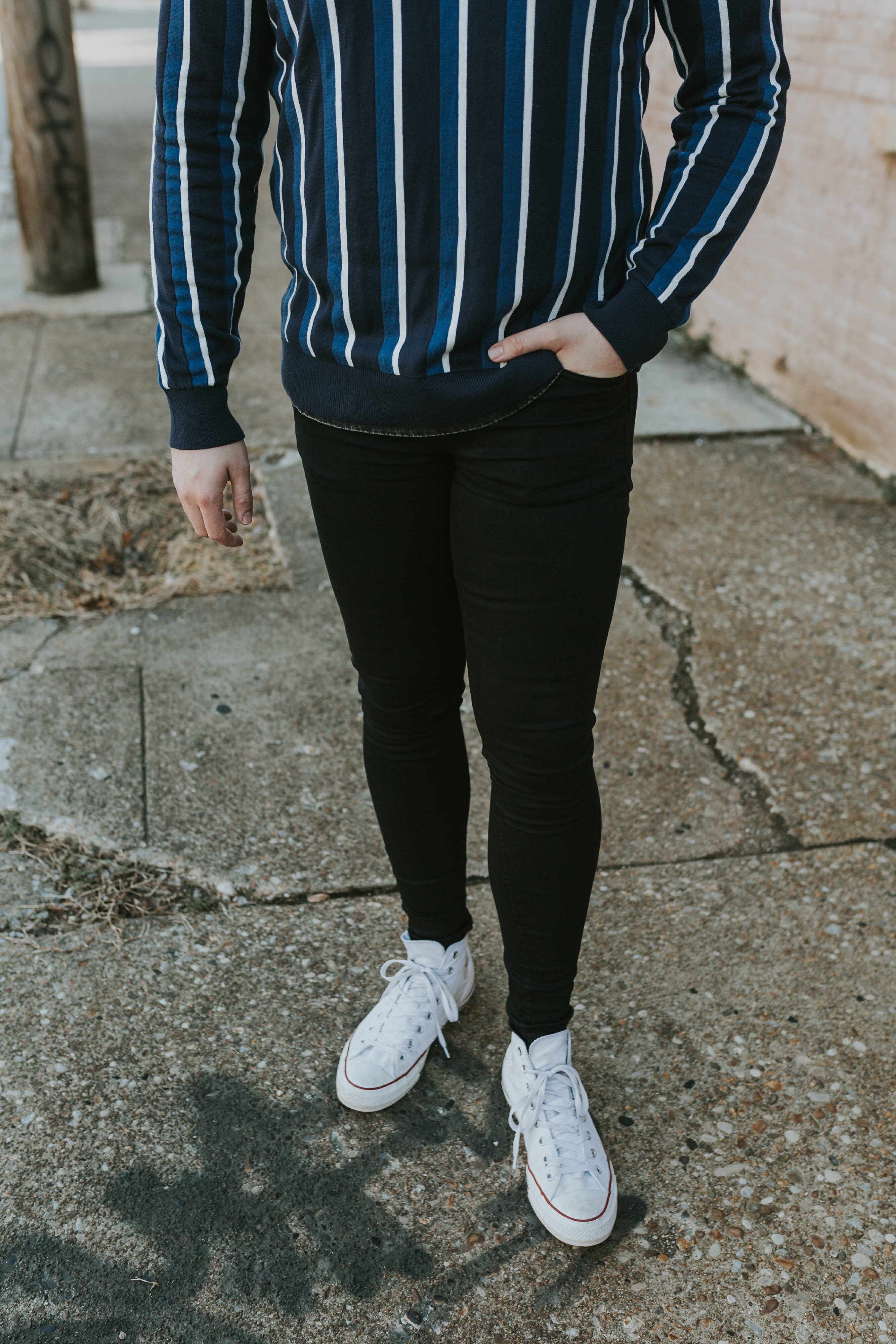 blue striped sweater with black jeans