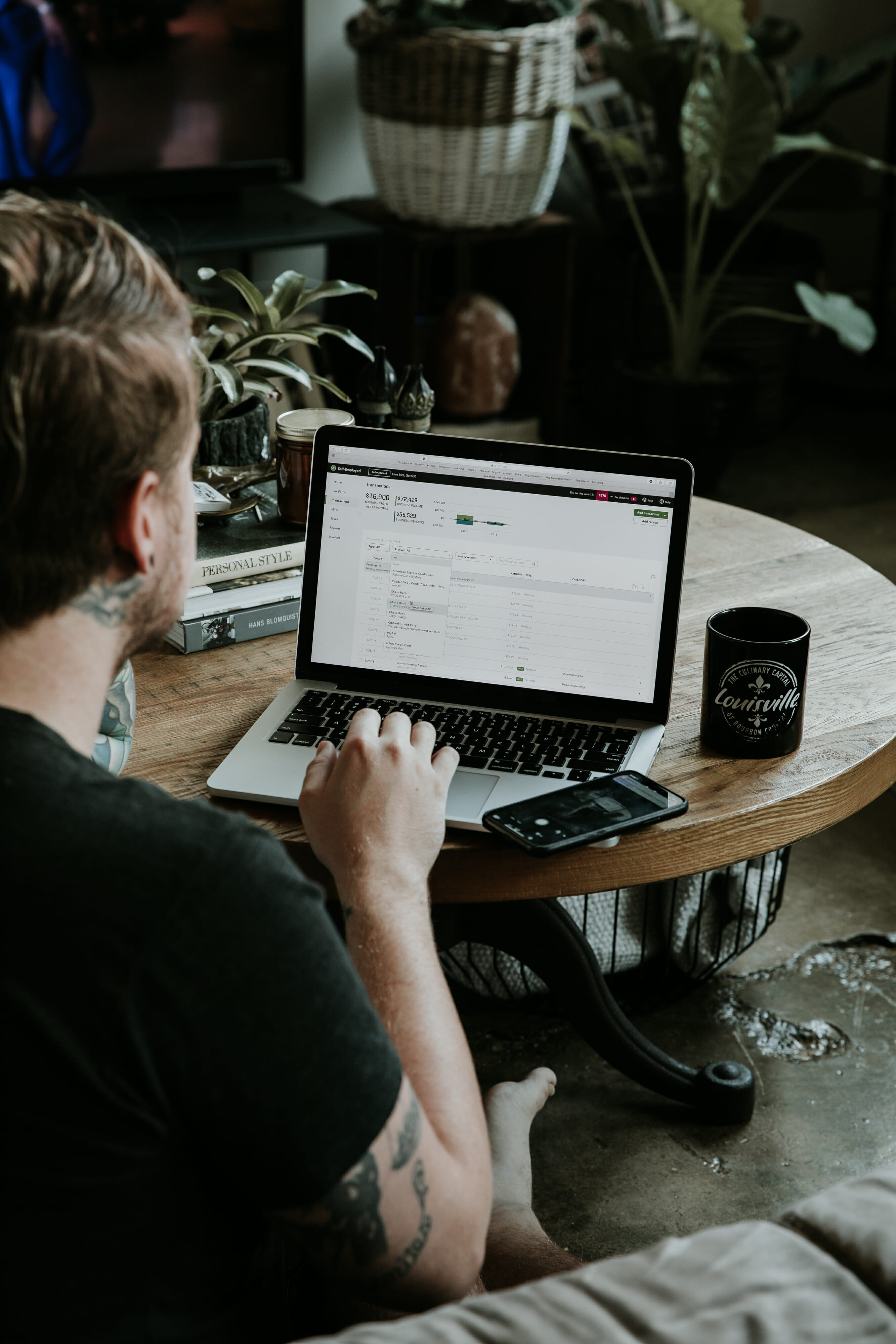 blonde man using computer