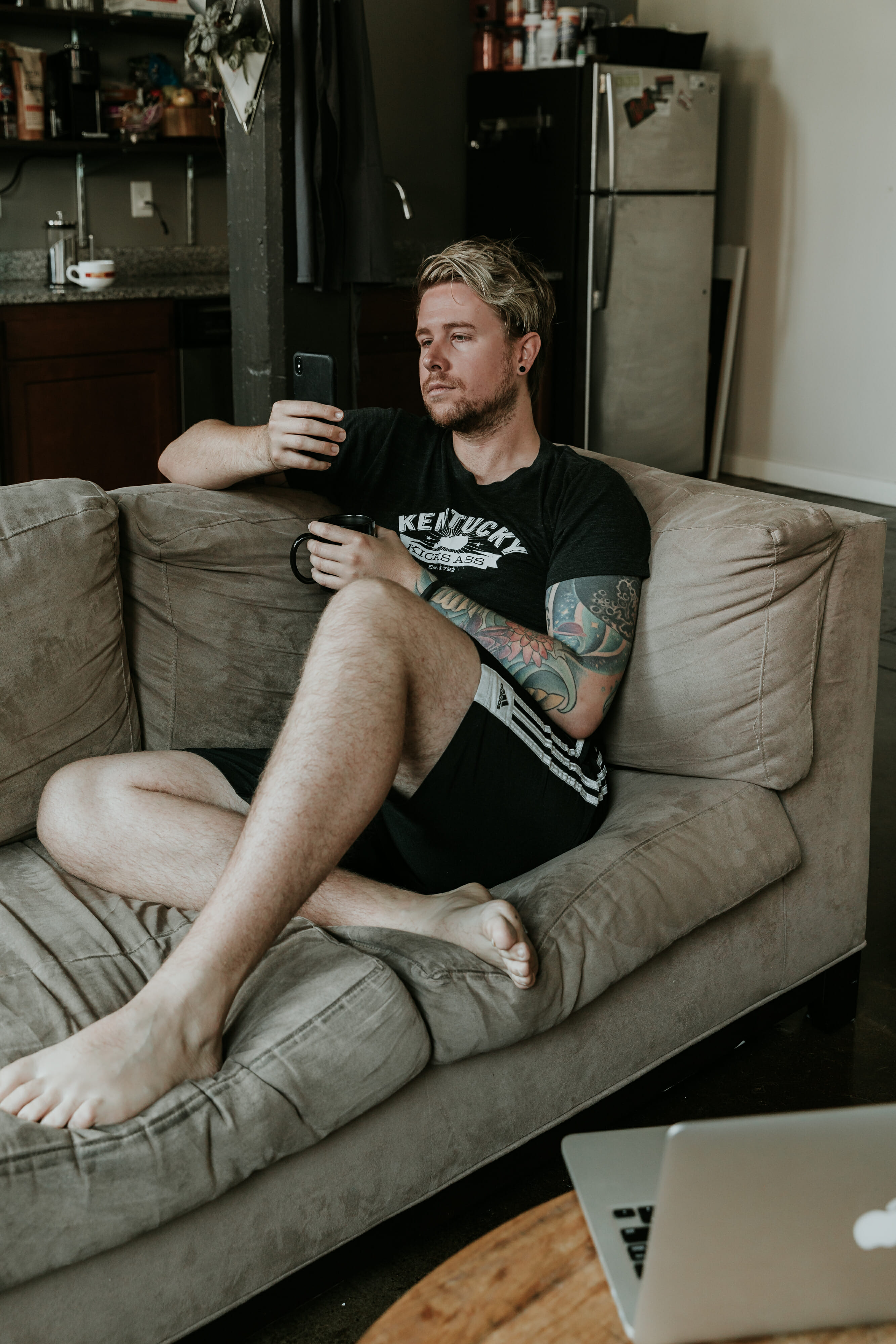 man sitting on couch