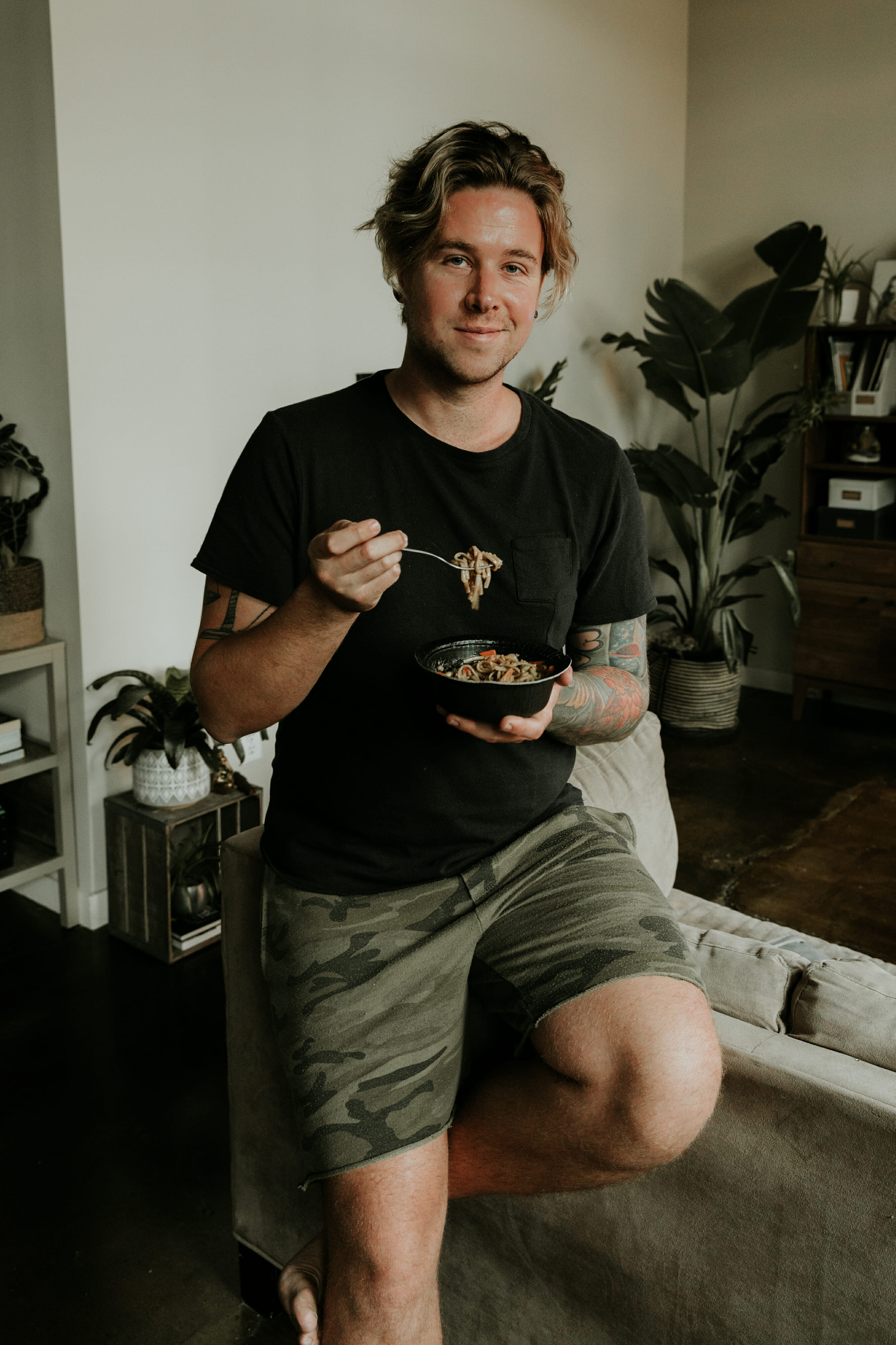 man eating gorton's seafood shrimp bowl