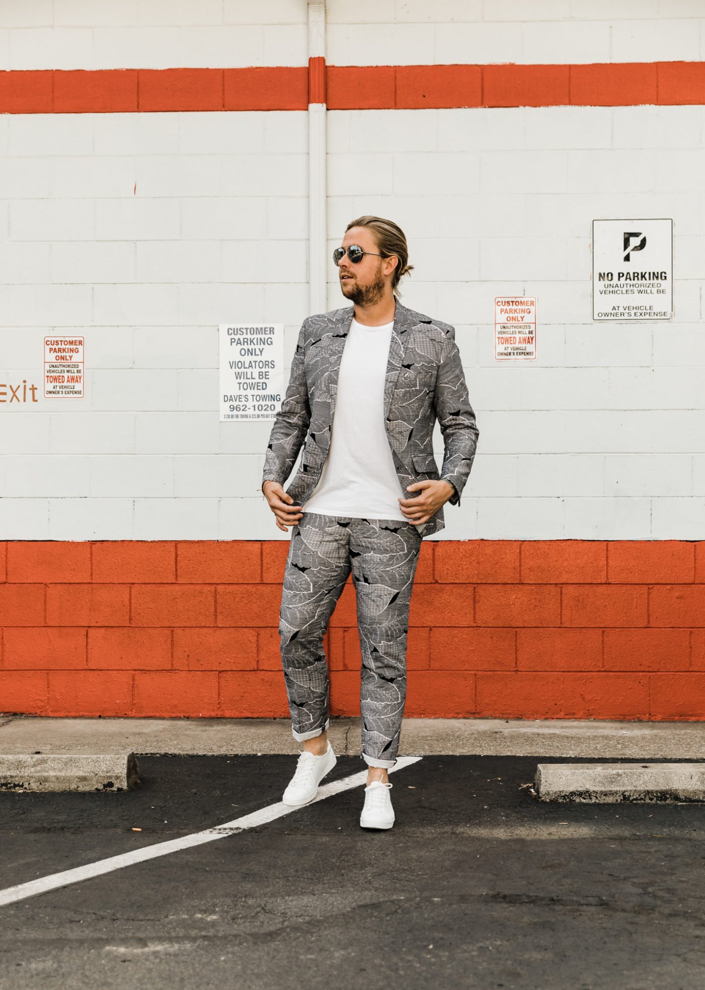 man in black and white suit