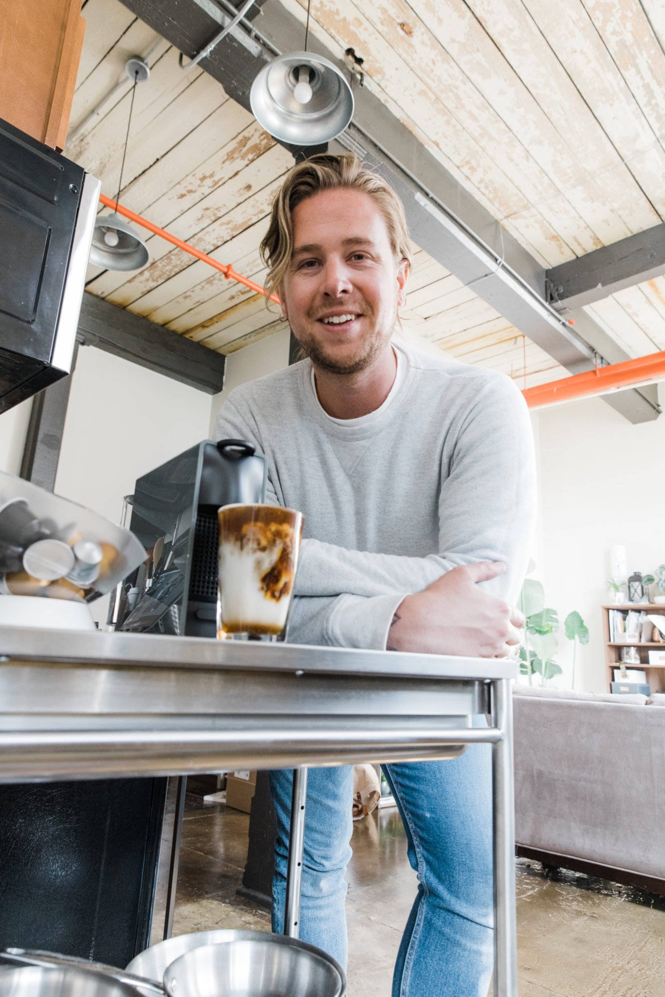 man with nespresso machine