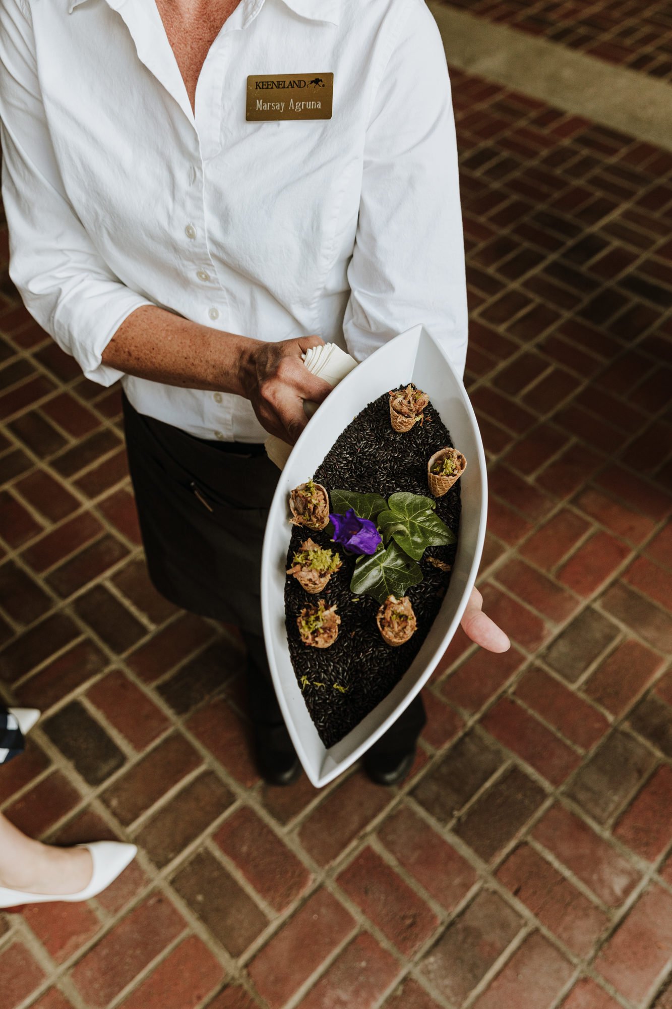 woman holding serving tray