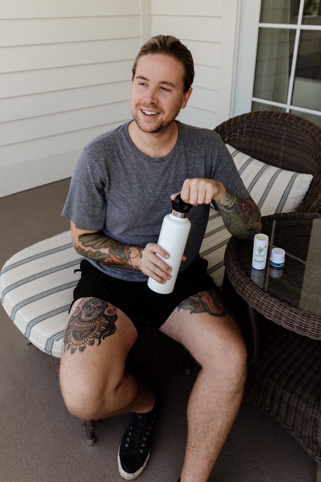 man holding reusable water bottle